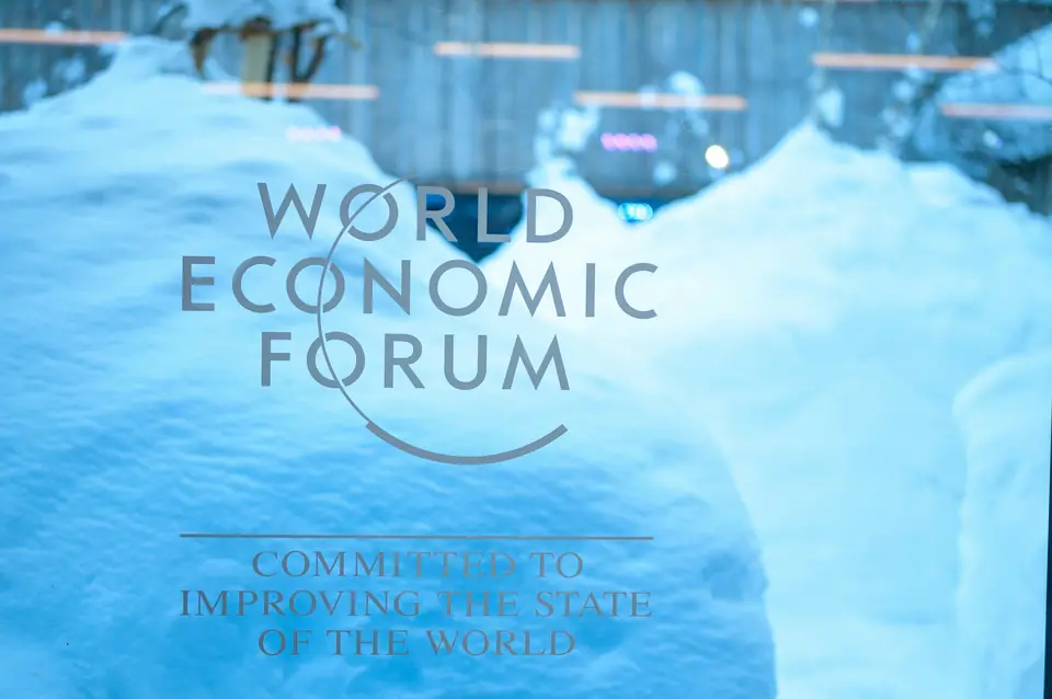 World Economic Forum sign on a window, banked with fresh snow